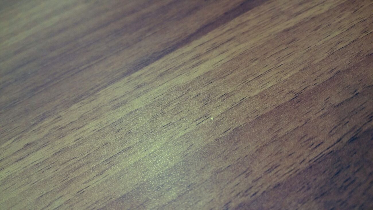 Detailed close-up of a smooth and textured wooden floor, showcasing natural grain patterns. – laminate flooring sale price