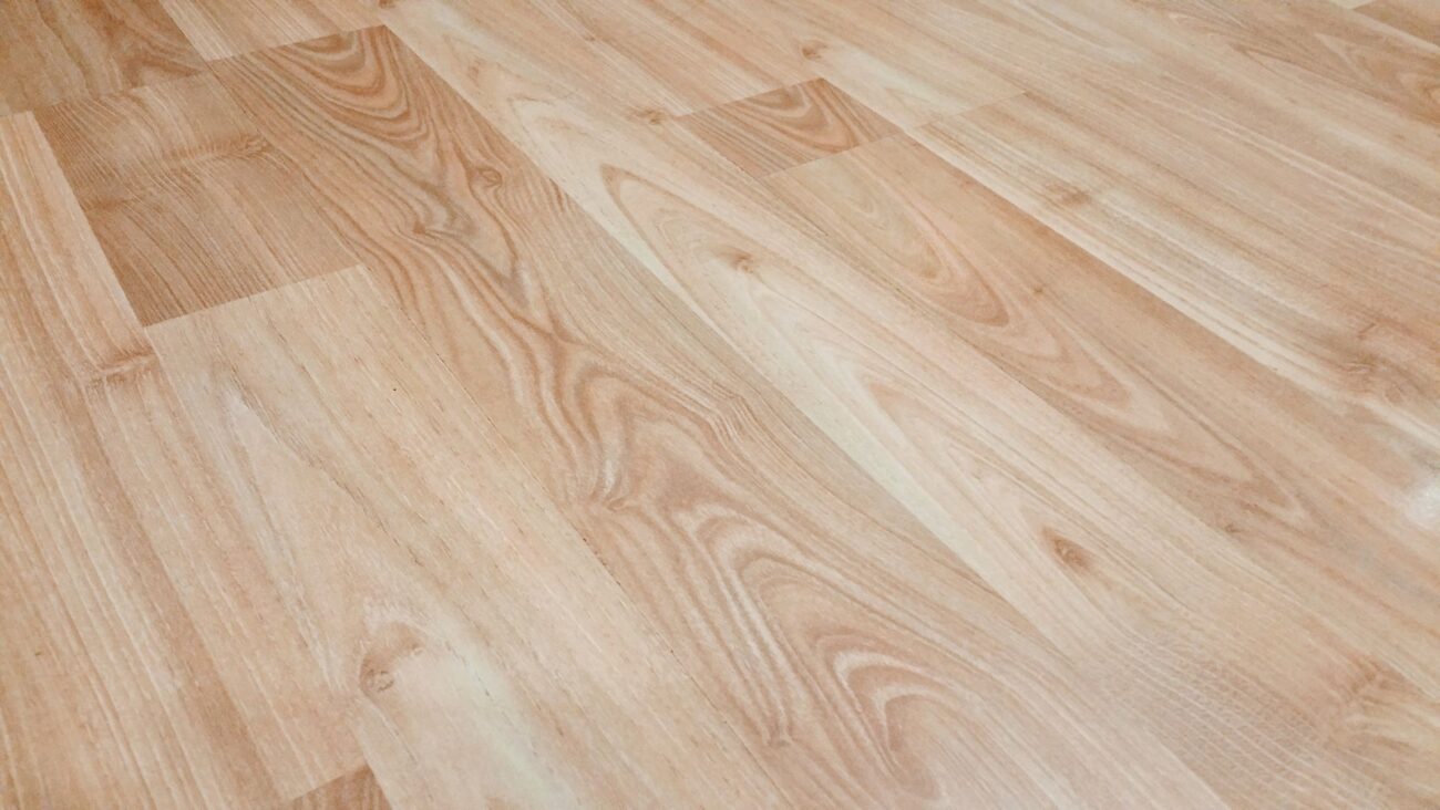 Smooth light brown wooden flooring with natural texture and patterns. – wholesale vinyl plank flooring benefits