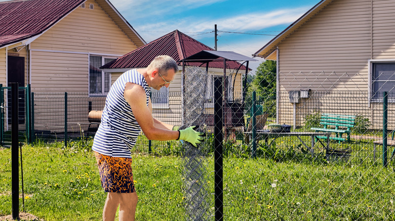 How To Reuse An Old Chain-Link Fence To Level A Bumpy Lawn On A Budget